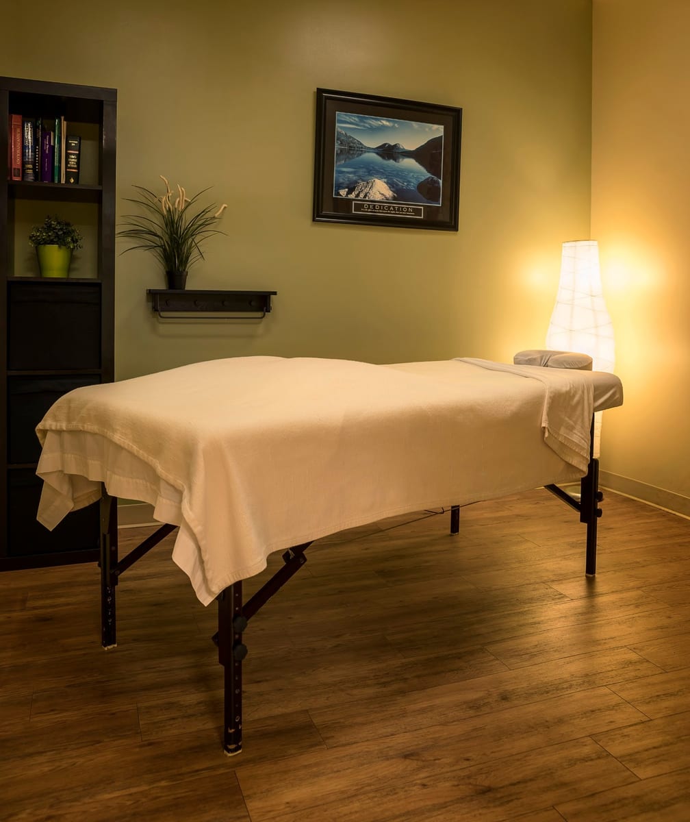 The massage therapy room at Fit For Life Physiotherapy, table made up and the lamp lit
